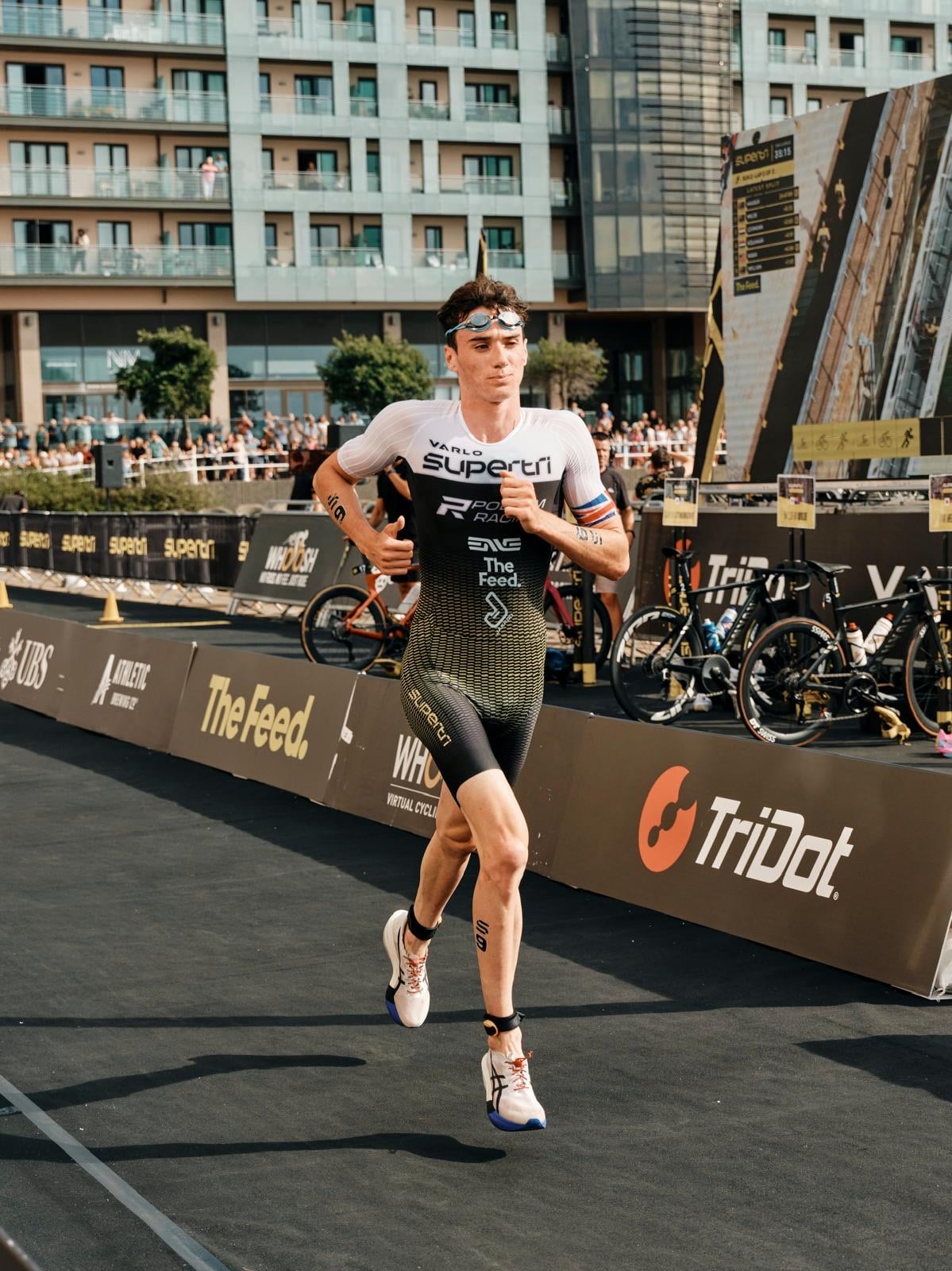 Michael Gar running in supertri kit at the Jersey Championship Final